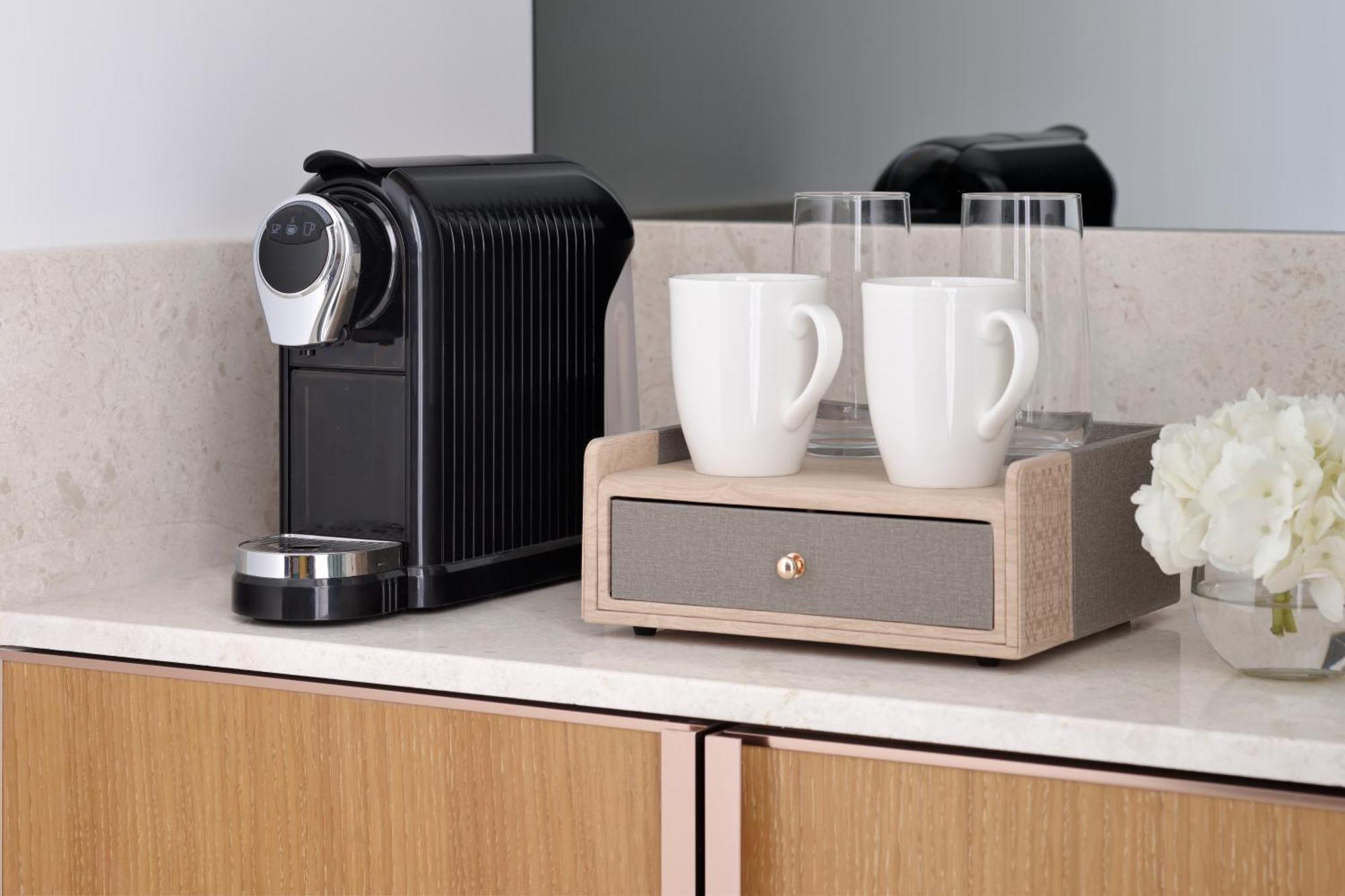 Moevenpick Hotel & Apartments Ghala มัสกัต ภายนอก รูปภาพ A Nespresso coffee machine